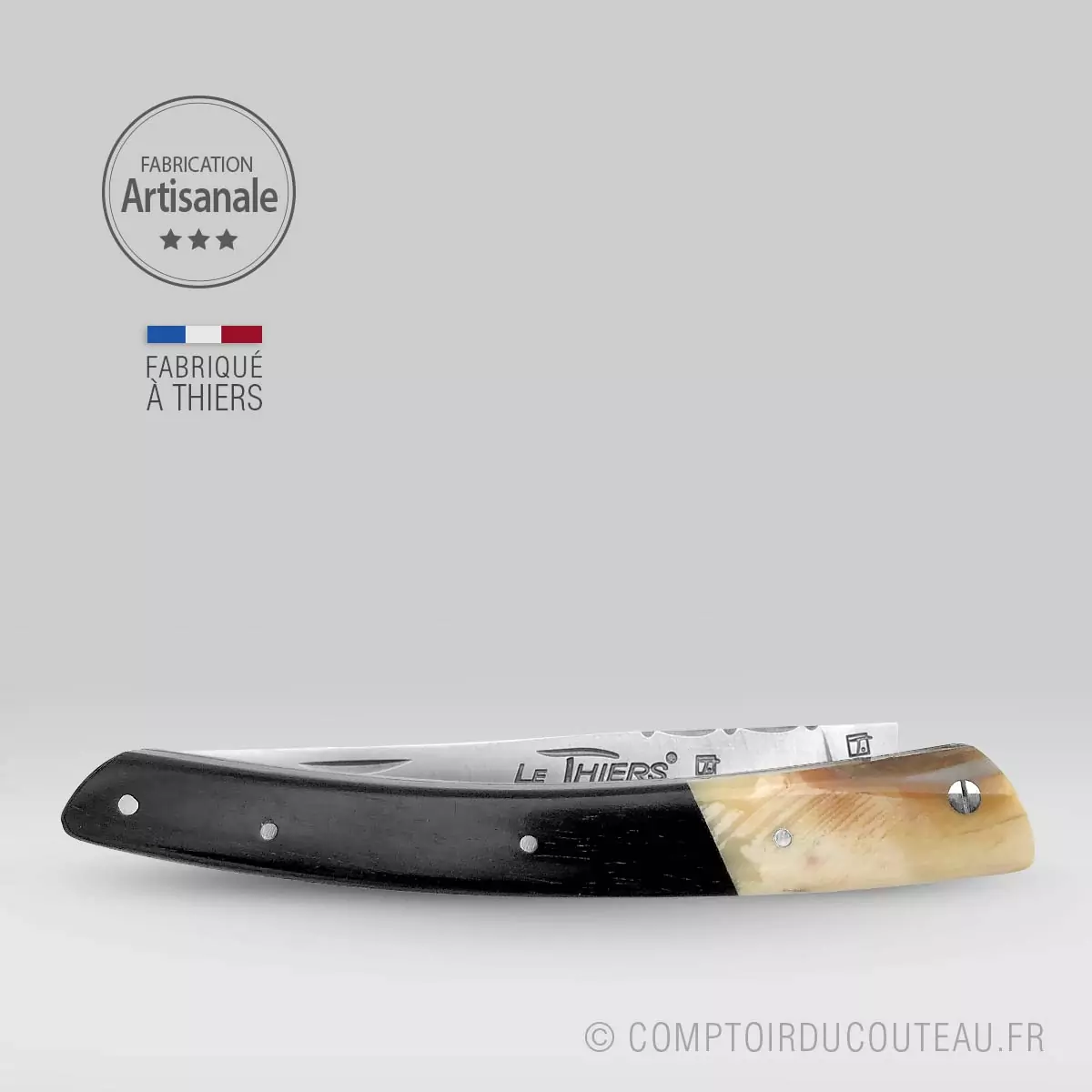 couteau le thiers prestiqge bi-matières manche en ébène et dent phacochère, lame et ressort guilloches
