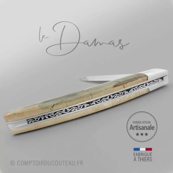couteau le Thiers lame damas manche croûte de mammouth ressort guilloche détail lame guillochage