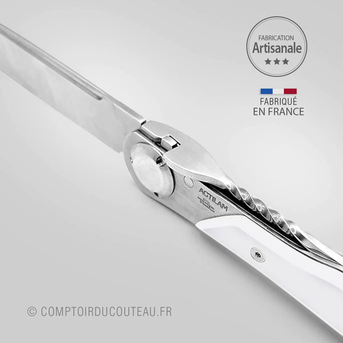 couteau Actilam T3c Corian blanc detail ressort torsadé